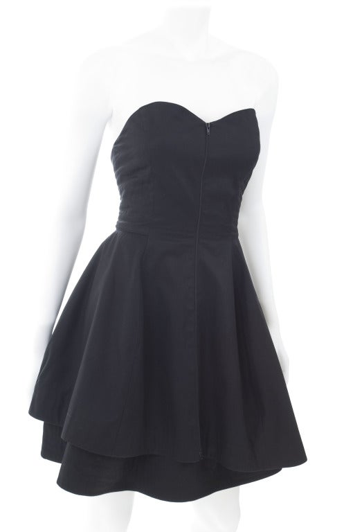 Montana Black Cotton Bustier Dress.
Front zipper. Asymmetrical double skirt.
Lightly boned
Size 42 EU

Measurements:
Length side seam 25.5