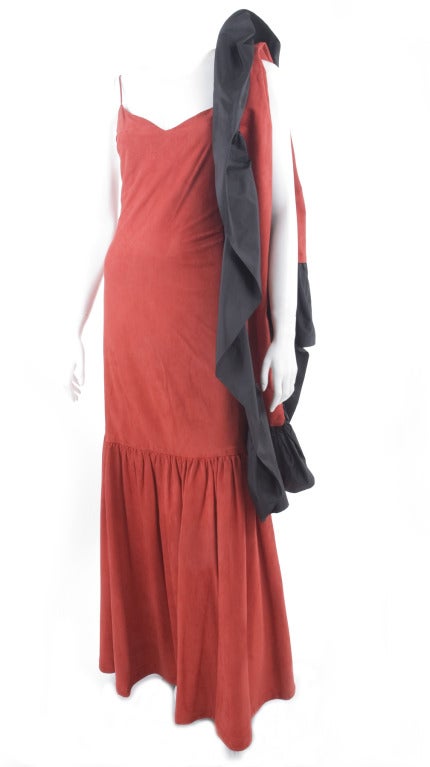 80's Stavropoulos, red suede leather and black silk taffeta gown. 
Spaghetti strap bodice lined with red silk. 
From knee hight down lined with black taffeta silk. 
The matching stole is a combination of the red suede and the black taffeta