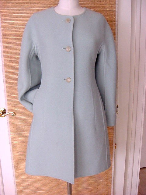 **Buyer MUST contact me prior to purchase for shipping and payment requirement details.
mad4couture@gmail.com**
Exquisitely shaped 3 button single breast knee length coat.
The softest of blue.
Large pale, pale seafoam buttons embossed 'H'! 
The