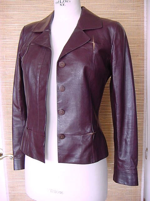 Guaranteed authentic CHANEL 01C fantastic light weight leather jacket.
Light weight, luscious lambskin leather leather in deep rich cordovan. 
4 hidden button single breast.
All buttons embossed CHANEL PARIS.
The front and cuffs have 'box slits'