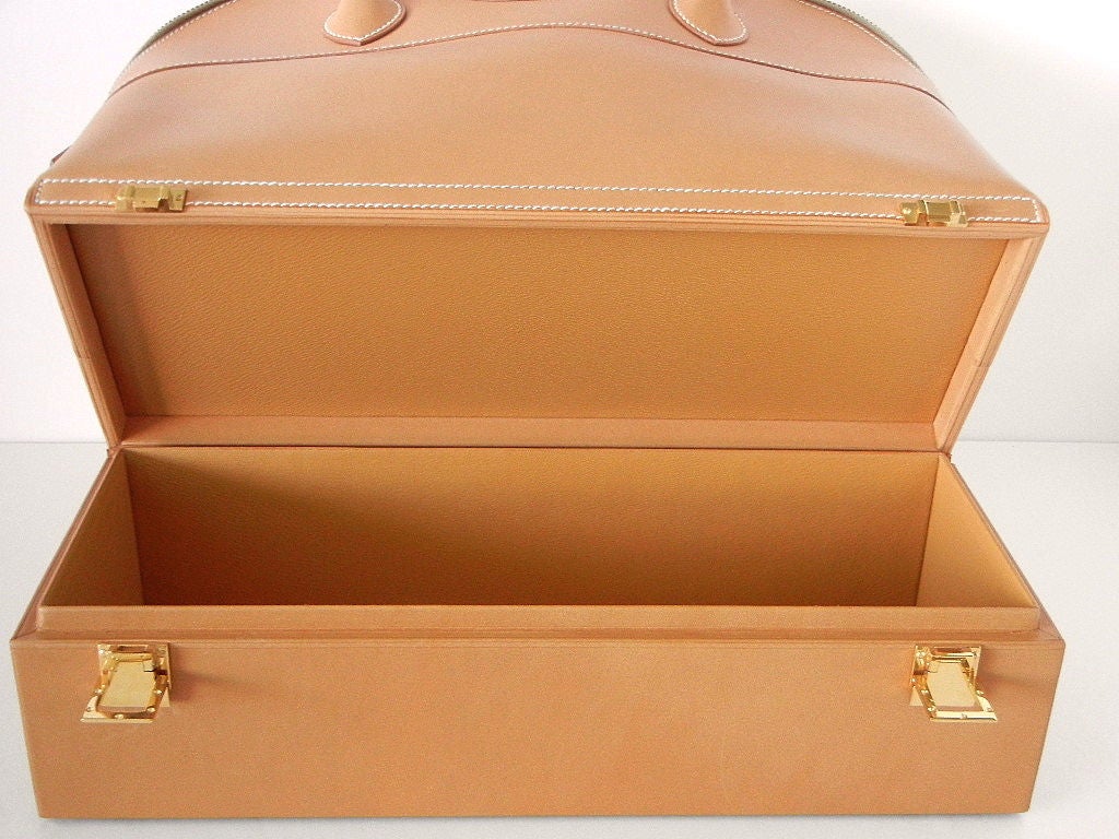 Extremely rare Hermes Vintage Macpharson  bag no longer produced. 
Chic in rare to find natural Vache Barenia. 
Comes with unopened detachable strap. 
Gold hardware with the subtle H opens the jewelry compartment at the bottom. 
The bag is superior