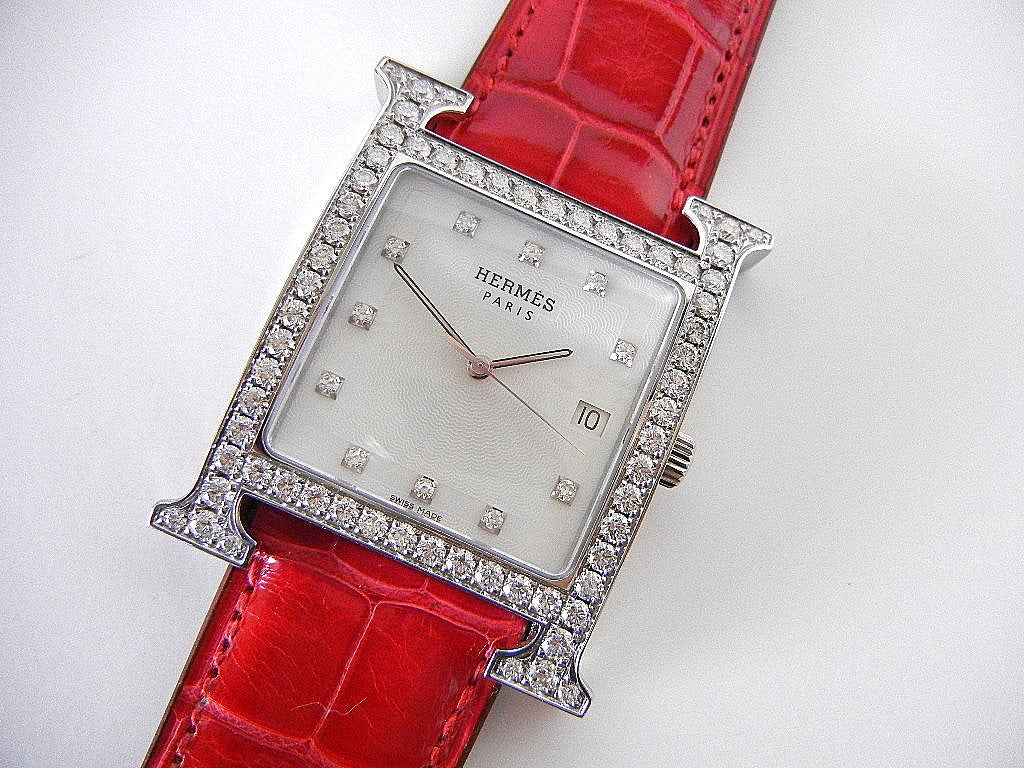 Exquisite large size diamond H watch. 
Diamonds are:  Clarity VVS. Rare white to rare white + colour. Full cut brilliance. 
Total diamonds 64.  
2.25 tcw with square diamonds for numbers. 
Coveted Rouge Vif matte alligator strap with palladium