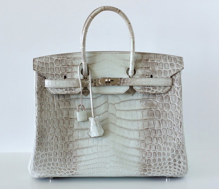 One of the most rare bags made by HERMES, the 35cm is even more rare to find! 
This exquisite HIMALAYA Nilocticus matte Crocodile is especially stunning as the bag is quite white with the soft taupe edges. 
The Palladium hardware accentuates the