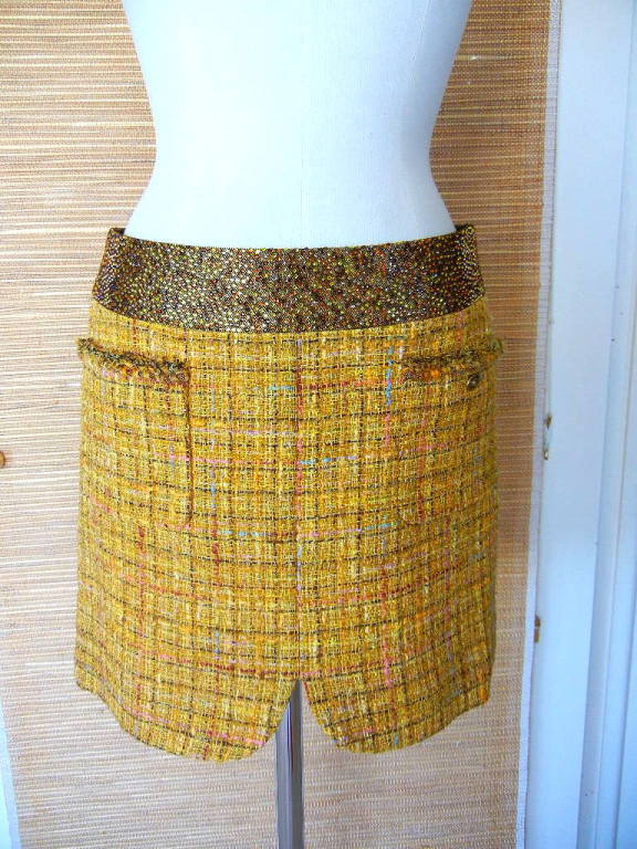 Guaranteed authentic CHANEL  11C fantasy tweed Runway skirt.
Utterly divine.
Mustard tone yellow with hints of blue, pink, lavender black and gray.  A very subtle metallic thread runs throughout.
2