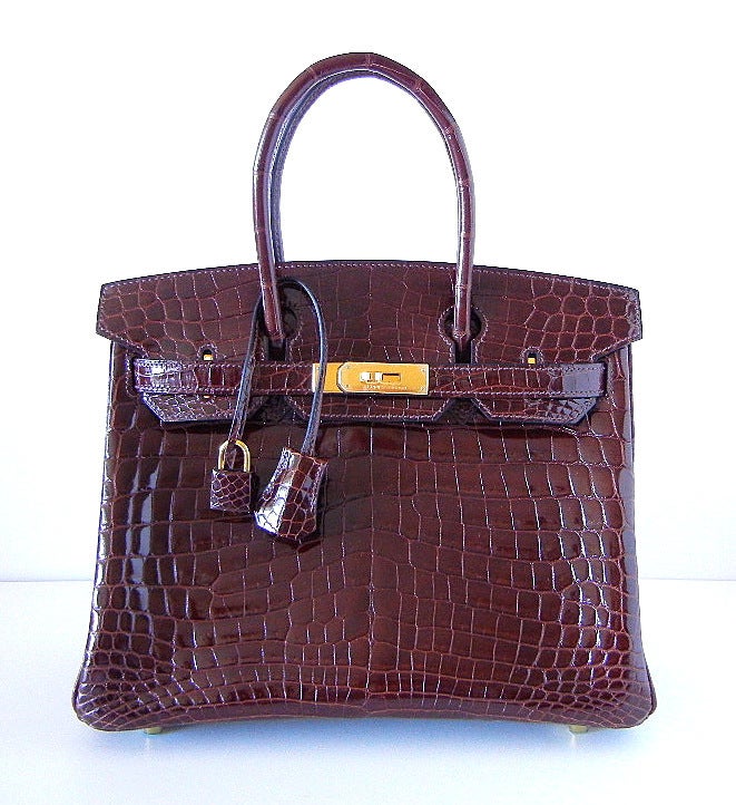 Utterly exquisite, 2die4, CHOCOLATE Crocodile HERMES Birkin. 
Sophisticated, chic and so delicious. 
This beauty is accentuated with the gold hardware. 
Perfect day to dinner size!  
BRAND NEW. NEVER CARRIED.  
Comes with the lock and keys in