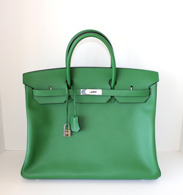 Fresh exotic BENGALE green with Palladium.
Unique in EPSOM leather creating a lighter weight and the leather keeps the shape of the bag beautifully.
Comes with lock, keys, clochette, sleepers, raincoat and signature Hermes box. 
NEW or NEVER