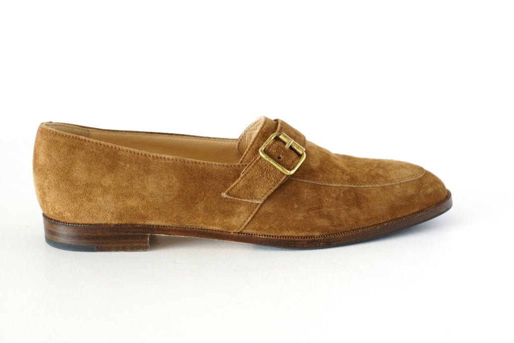 Beautiful rich camel suede loafer. 
Cut high on the foot with a softly rounded toe.
Strap with gold buckle across the front.
Small stacked wood heel perfect for all day comfort. 
Timeless. 
**Please note:  the colour is more brown to the eye.** 