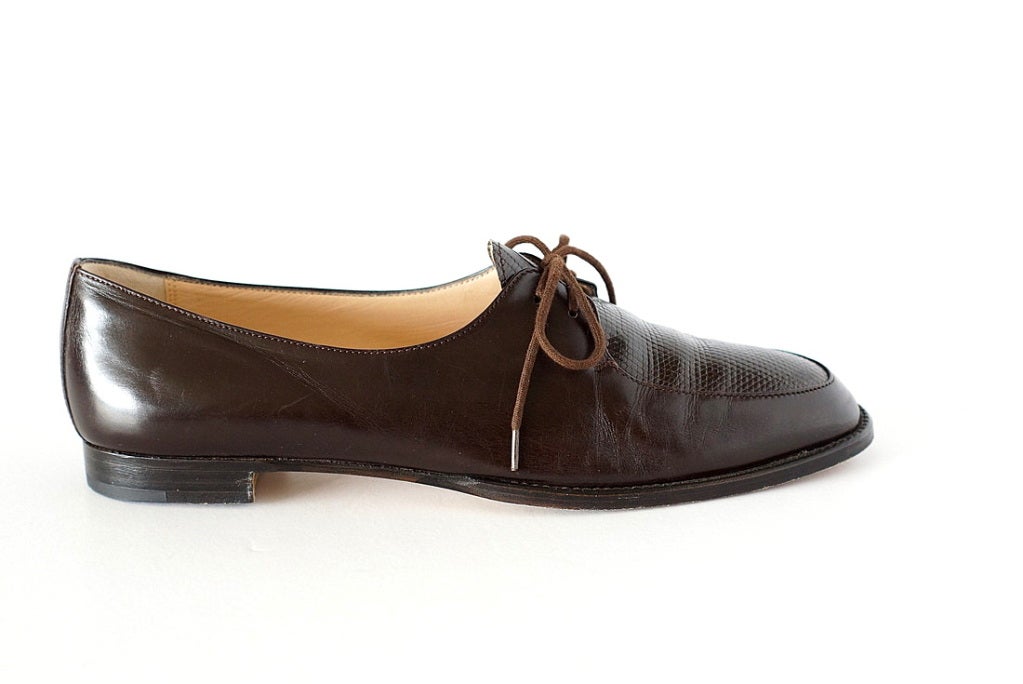 Guaranteed authentic MANOLO BLAHNIK  lace up loafer with lizard inset.
Fabulous dark brown leather lace up loafer. 
Classic style with a softly rounded toe.
Center inset is lizard.
Small stacked wood heel perfect for all day comfort. 
more