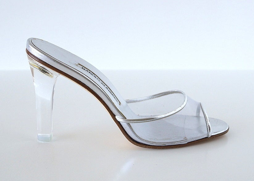 Guaranteed authentic MANOLO BLAHNIK most divine mule ever!  LUCITE with a silver upper sole and trim over the lucite piece across the foot.  
Nothing is as neutral, as sexy as perfect. 
BRAND NEW.  NEVER WORN. 
Perfect for a foot size 8 1/2 to 9.