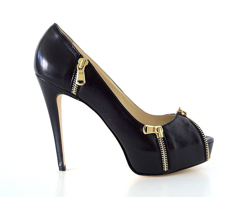 **Buyer MUST contact me prior to purchase for shipping and payment requirement details.
mad4couture@gmail.com**
Stunning jet black peep toe pump with a hidden platform.
The open toe is edged with a bold gold zipper with the pull at the