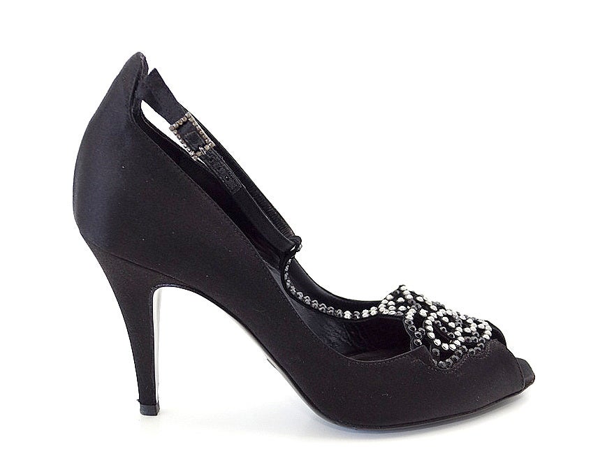 Guaranteed authentic Giorgio Armani  fabulous peep toe T-strap with marvelous diamante detail.
Beautiful black satin evening peep toe pump.
The front of the toe is covered in a deco like black and silver diamante design with a double row or