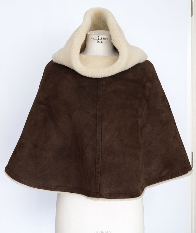 **Buyer must contact me prior to purchase for shipping and payment requirement details.**
mad4couture@gmail.com
Rich plush brown shearling cape that just covers the elbow area. 
Gorgeous cut.  
The collar shows the shearling.   
Fabric is