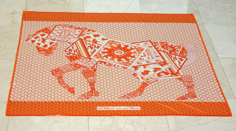 Rare HERMES print fluid jersey silk scarf, 'A CHEVAL SUR MON CARRE'. 
Stunning equestrian motif with intricate drawings.  
Colors are blanc, orange and capucine.  
Signed by P. Peron.  
BRAND NEW. NEVER WORN.   Comes with box 
more pictures