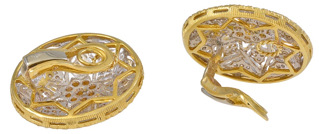 Beautiful, shimmering 18k gold large ear clips.Set with approx. 2cts of faceted diamonds.Brushed gold. Very fine pierced work. A significant and lovely all-over diamond look.