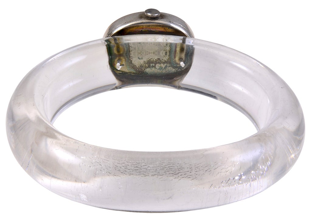 Striking Obrey lucite quartz bangle watch. Roman numerals. Framed by a sterling silver bezel. For a larger wrist. Great look.