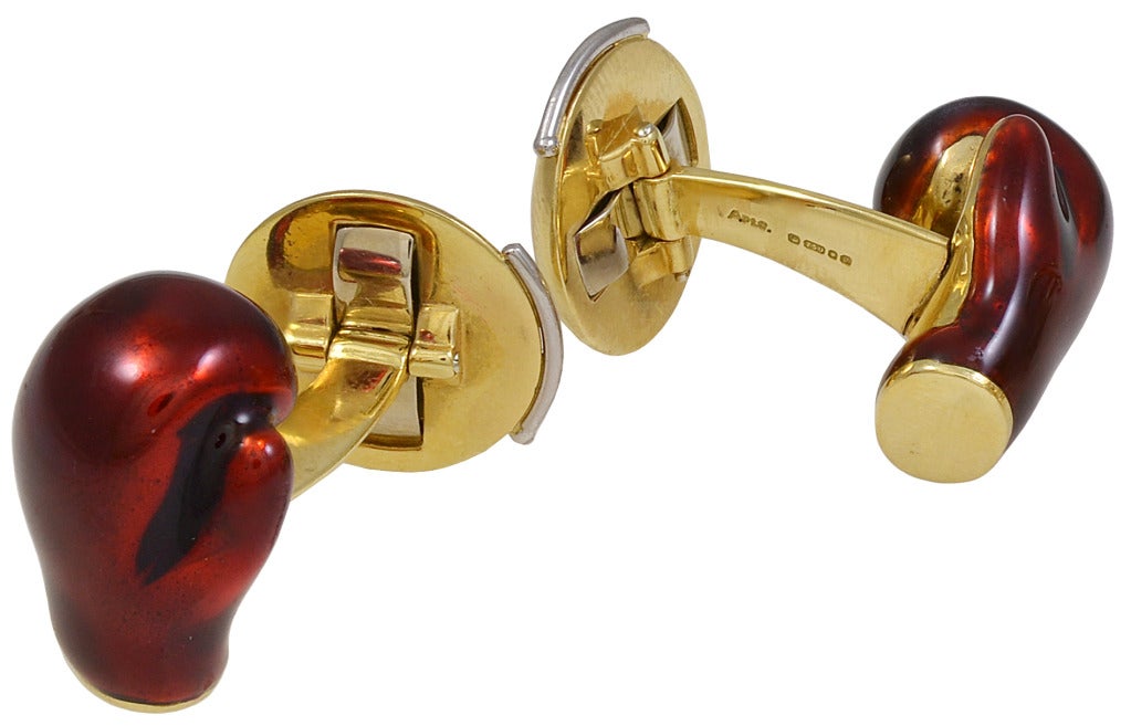 Asprey 18K gold and enamel cufflinks. Front is red enamel figural boxing glove. The back is figural ringside bell.
Great subject, rarely seen.
