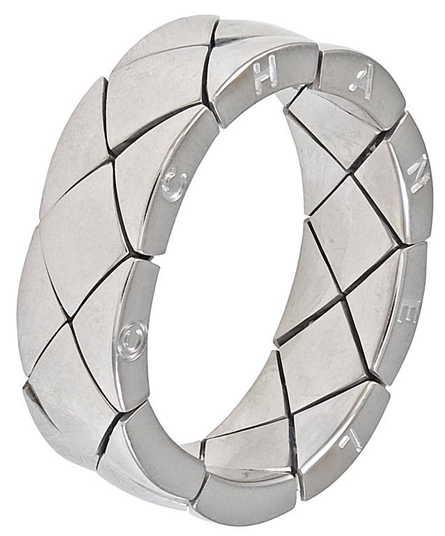 18K white gold flexible band in the quilted pattern made and signed by Chanel. Size 9 1/2. A signature look.
