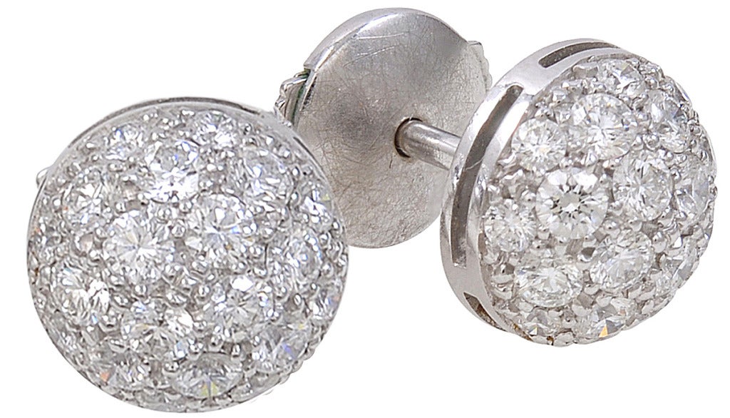 Brilliant pave diamond stud earrings, made and signed by Cartier. 1.50cts of sparkling white diamonds. Set in 18k white gold. These earrings create an all -over diamond look and they dance on the ears.