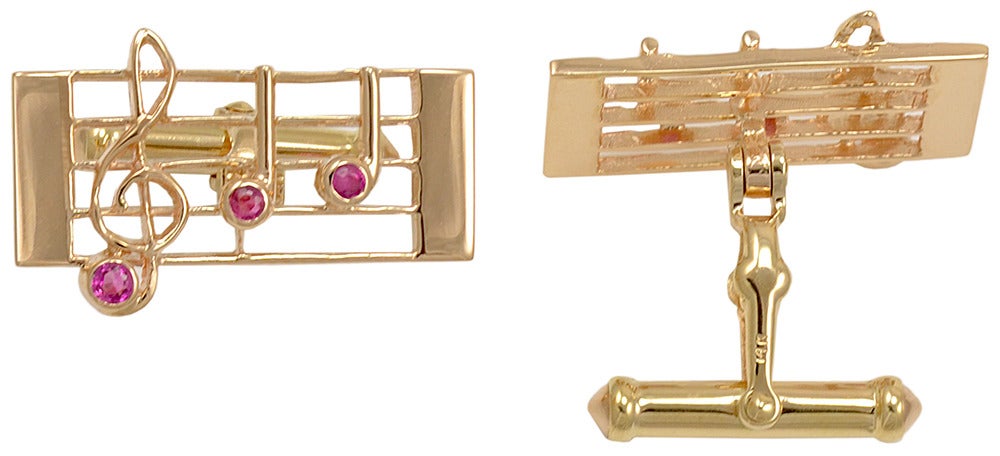 Terrific, unusual subject . Musical bar with clef and notes, 14k gold. Set with faceted rubies. Perfect for the music lover in your life.