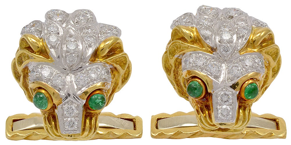 Majestic figural lion head cufflinks, 18K gold, made and signed by David Webb.
Mane encrusted with diamonds; cabochon emerald eyes. A strong dramatic look.
