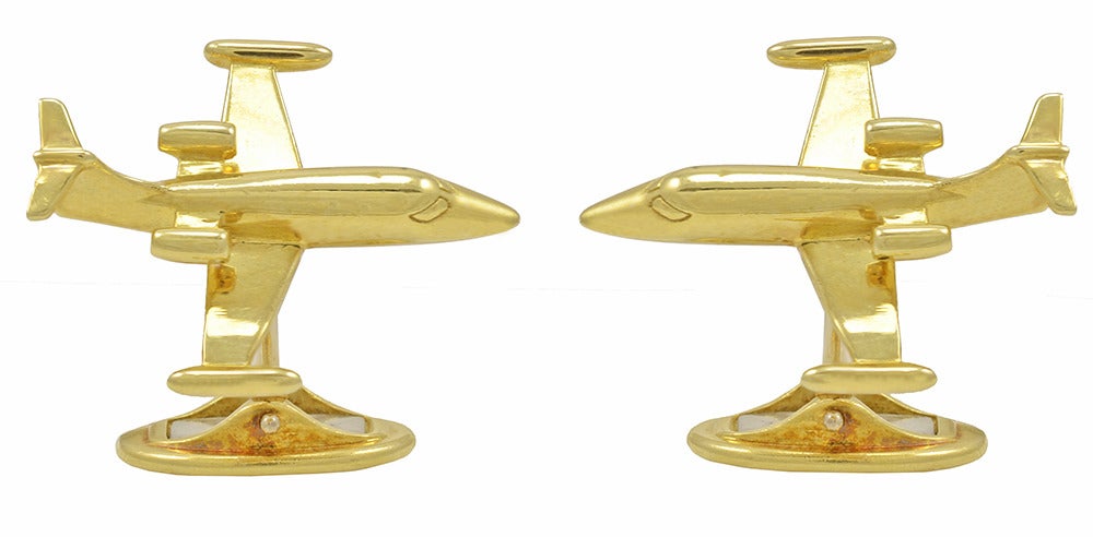 Figural airplane cufflinks set in 18k yellow gold.  Nice large size, well- rendered.
The back has an easy to use 