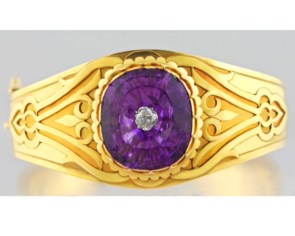 Rare Arts and Crafts 18k gold Antique Bangle set with large faceted Amethyst with center Diamond.This bracelet is very beautiful and the gold has a special glowing finish.Wonderful craftsmanship.
A very special piece.to wear and enjoy.