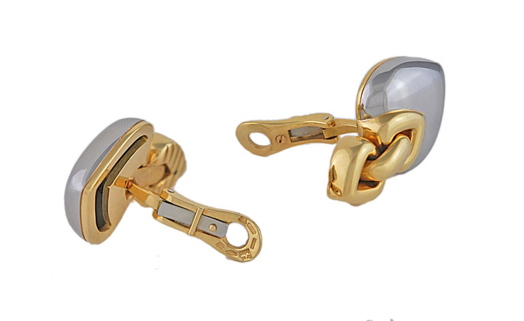 Estate Bulgari 18K and steel heart clip earrings. Composed of two heart- shaped pieces, yellow gold on the top and steel on the bottom half