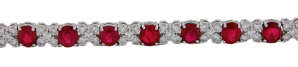 Spectacular Estate Ruby and Diamond bracelet.<br />
18K white gold  set with approx. 6.80 cts of bright full cut diamonds and 8.50 cts of brilliant faceted rubies. Superb color.<br />
7