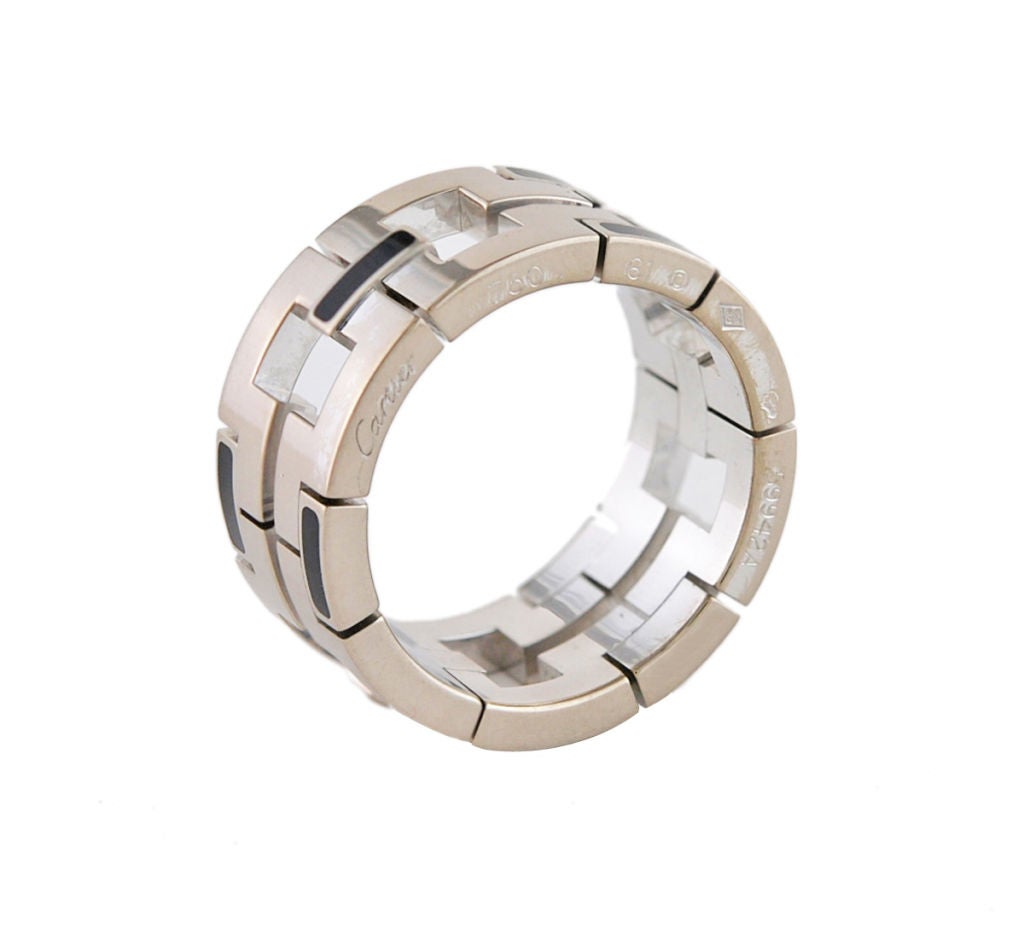 Cartier Paris 18K white gold ring. Wide, heavy band with black enamel and open work. <br />
Size 9 3/4<br />
1/2