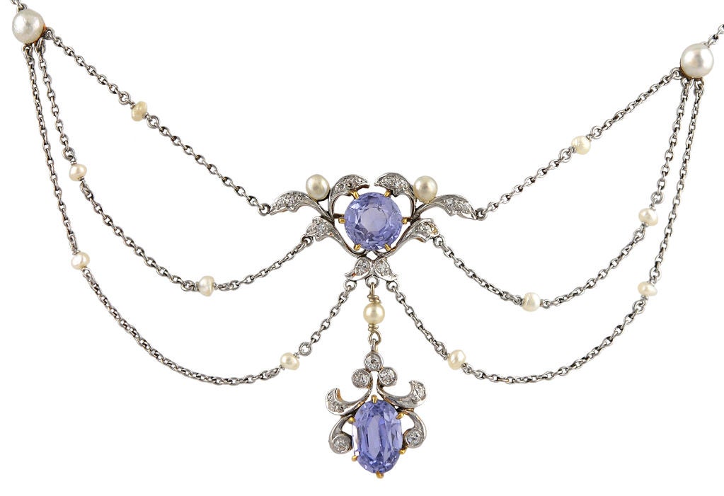 Graceful Edwardian necklace. Beautifully faceted sapphires, set with diamonds and pearls. Platinum and 14K gold. Lovely 