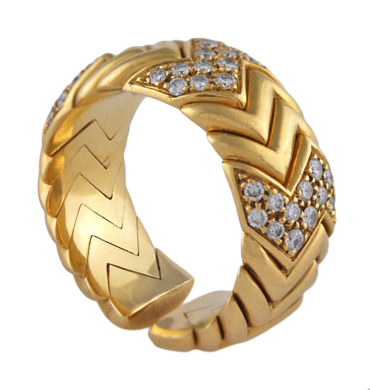 Striking geometric 18K Gold and Diamond ring signed Bulgari<br />
Somewhat flexibe. Fits a 6 1/2 to a 8 1/2 ring size.<br />
Excellent design ; looks and feels very solid