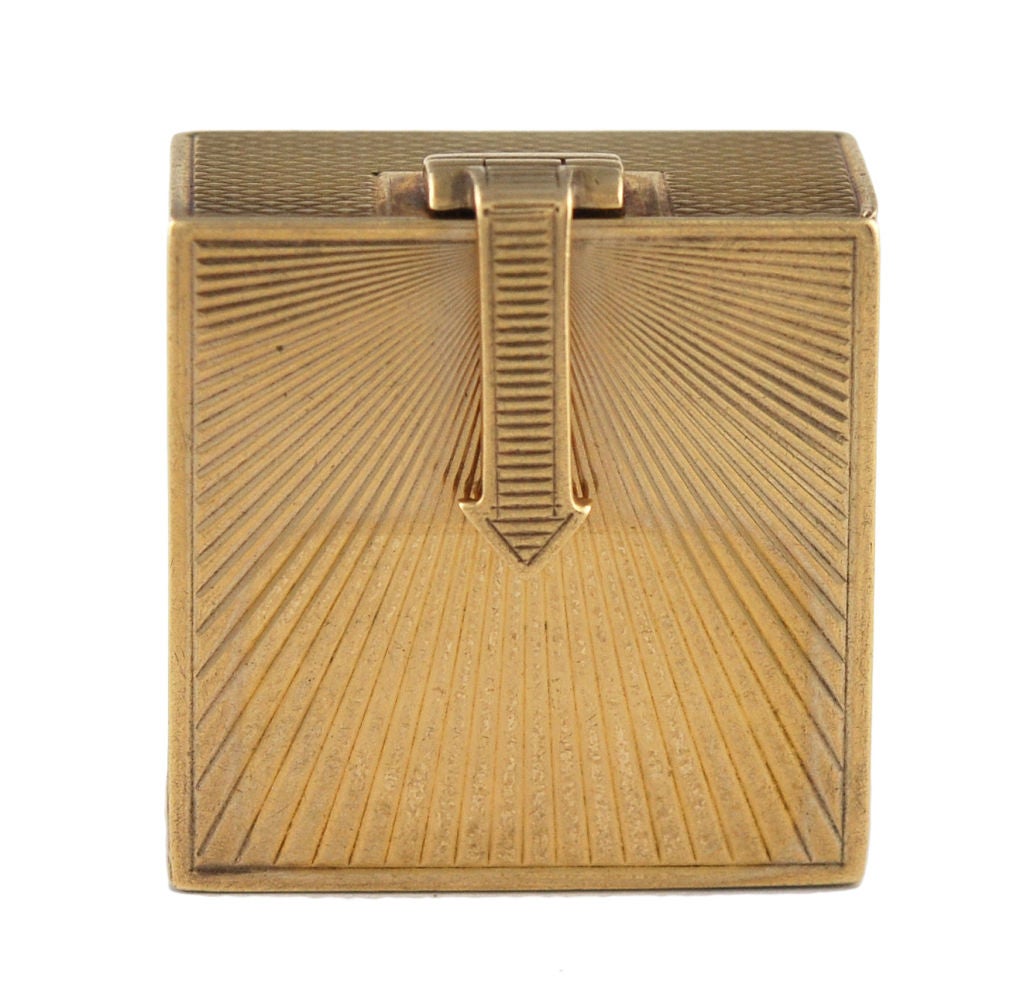 Tiffany 14K gold pill box with arrow closure.<br />
The entire box has 2 different types of engine turning,giving it a finely polished and detailed look