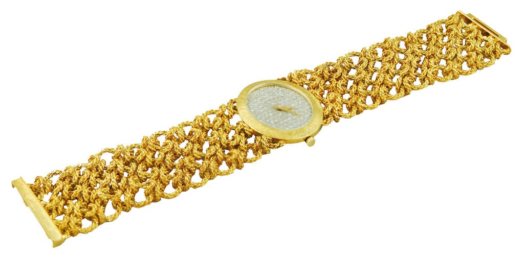 Bueche Girod 18K gold and diamond watch. Wide intricate link bracelet with oval all diamond face. Total  diamond weight 3cts.<br />
<br />
Very special and striking. Takes your breath away.
