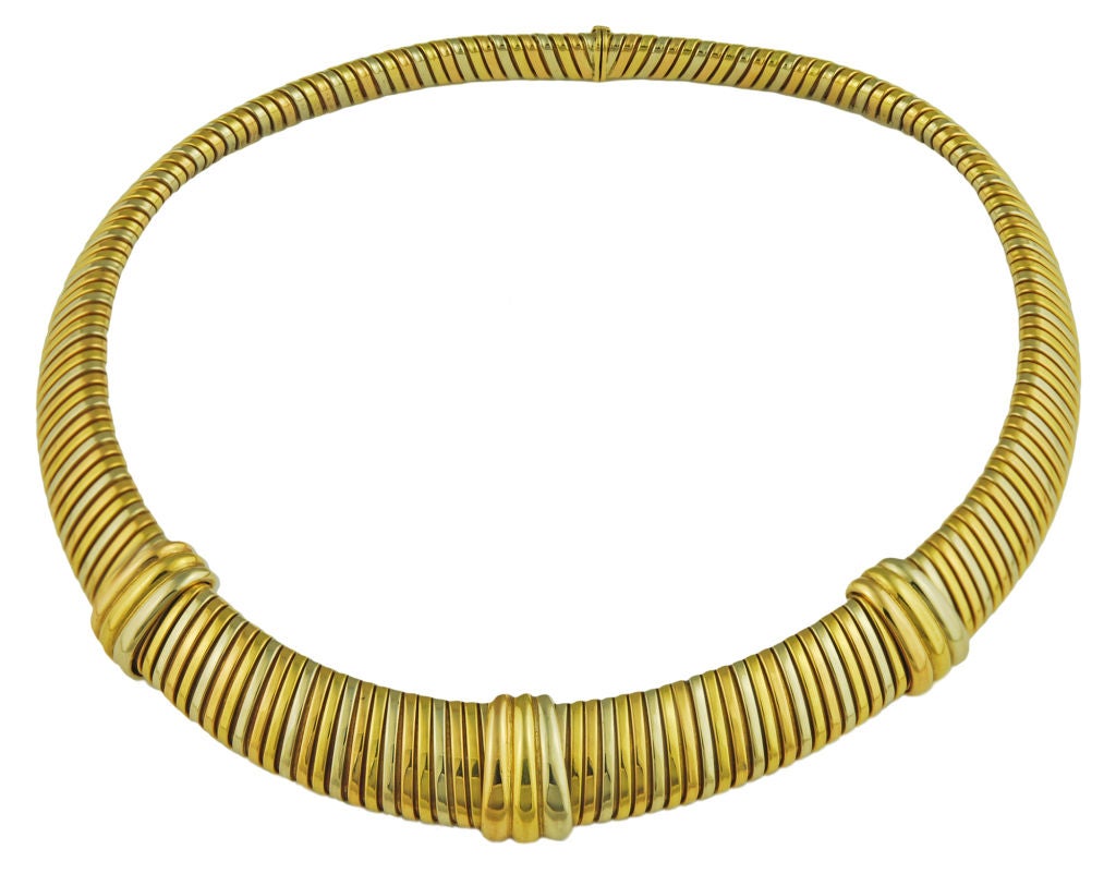 Cartier flexible 18K gold fluted choker.<br />
Very elegant and impressive look which lays beautifully on the neck.