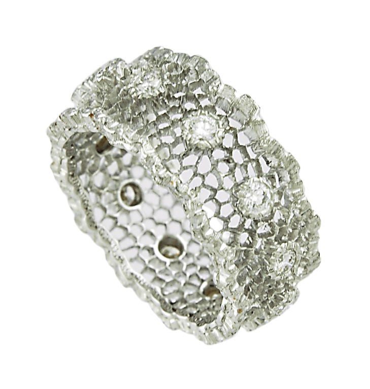 Equisite lacey Mario Buccellati 18K white gold band encrusted with 12 faceted full cut diamonds. Beautiful feminine look.<br />
Size 6 1/2