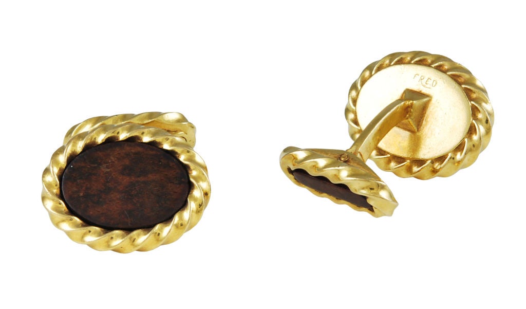 Chic double-sided 18K gold and wood cufflinks made by Fred Paris.
Wonderful rope design borders the wood center.  Approximately 3/4 x 3/4