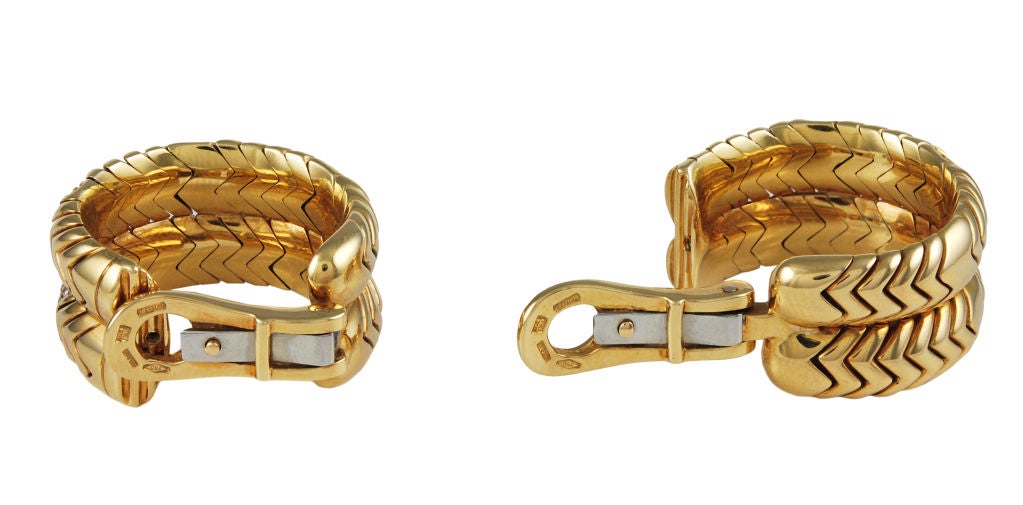 Chic BULGARI double row Spiga ear clips. Chevron pattern, set in 18k gold interspersed with diamond chevrons.A very wearable, crisp looking earring, which is no longer being made.