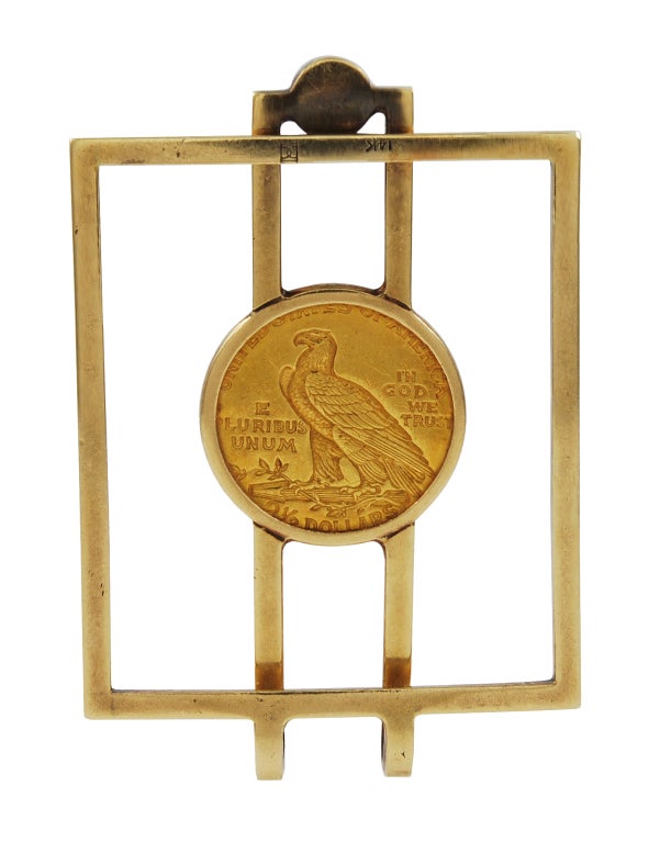 Unique money clip, 14k gold, set with a cabochon sapphire.
The center shows an Indian wearing a feather headdress; on the back 