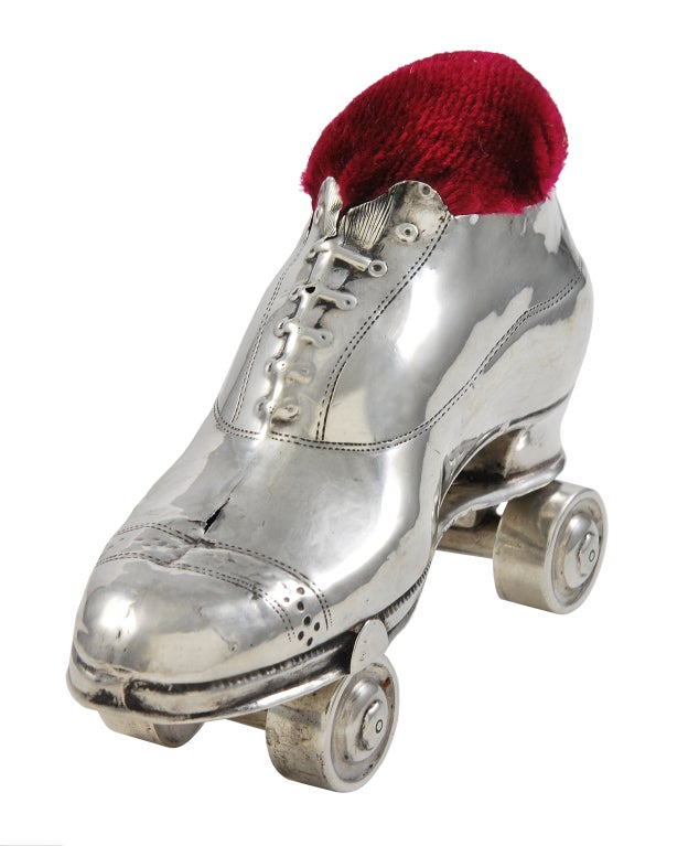 Figural Sterling Silver roller skate pincushion with moveable wheels. Well-detailed and solidly made.A most whimiscal addition to your collection