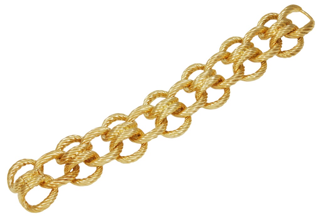 Wide chunky 18K gold link bracelet. Interwoven nautical links.Substantial look and feel. An exceptional bracelet.
8