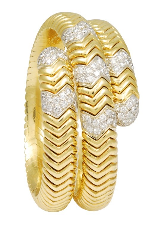 Large Snake Cuff Bracelet,adorned with diamonds;
 18K gold.Beautifully made.
 Very heavy and very impressive