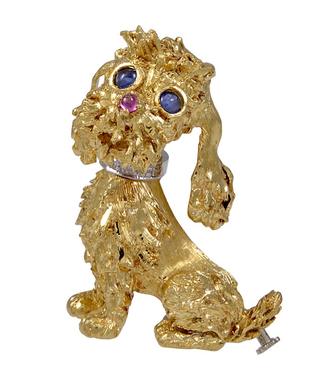 Very fetching and endearing 18K gold figural poodle pin. Cabachon sapphire eyes, ruby nose and brillant cut diamond collar!
This doggie needs a home!