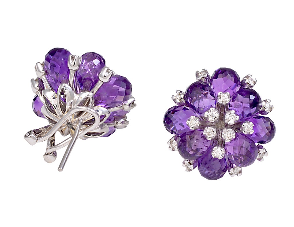 Bright, brillant faceted amethyst and diamond ear clips set in 18K white gold.The amethyst briolettes are completed faceted and shimmering, encrusted with diamonds. A festive look!