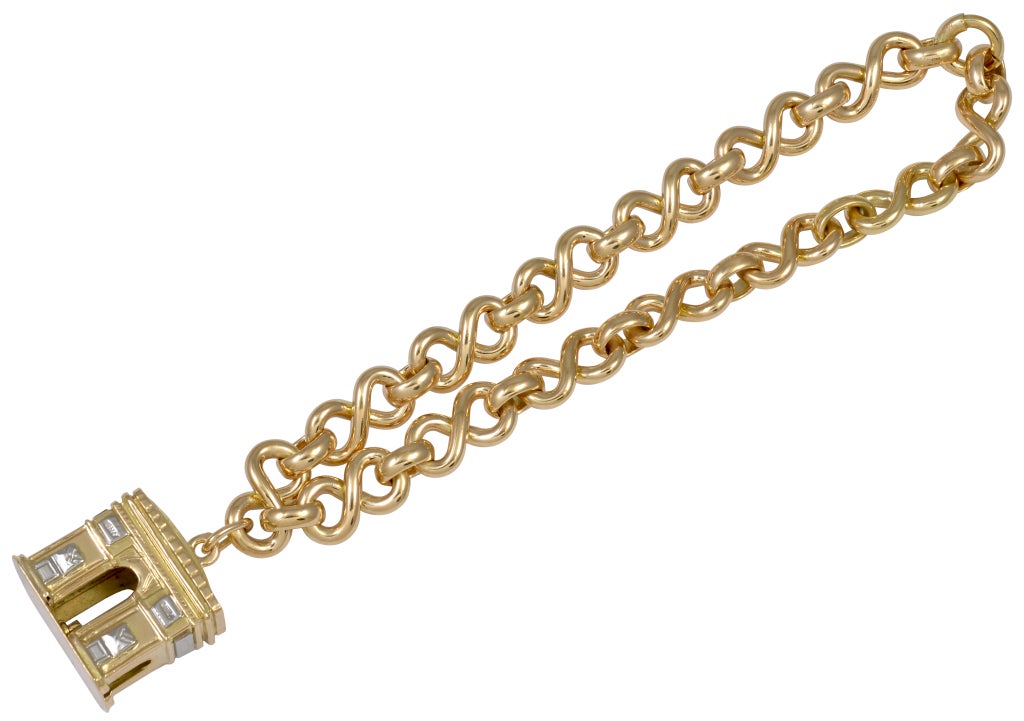 Classic 18K gold charm bracelet with large Arc deTriomphe charm.
Signed and numbered by Cartier. Beautiful silky figure eight links, which are no longer made. For the woman who loves Paris.
Alice Kwartler has sold the finest antique gold and