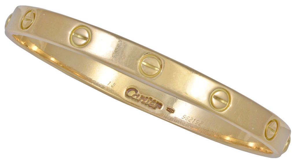 Cartier 18K gold Love bracelet with screw driver.Older model , heavy and soild. Classic timelless screw design. Oval shape in size 20. The LOVE bracelet is a tribute to its namesake. A perfect loving gift.

The bracelet has the original