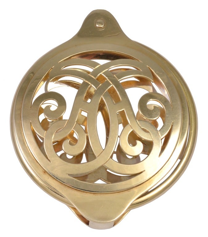 Fabulous one of a kind large magnifying glass made by CARTIER encased in lacey open work holder in 14K gold.
Polished glass magnifier swivels out to provide strong clear magnification.
This is a large impressive striking piece of jewelry which is