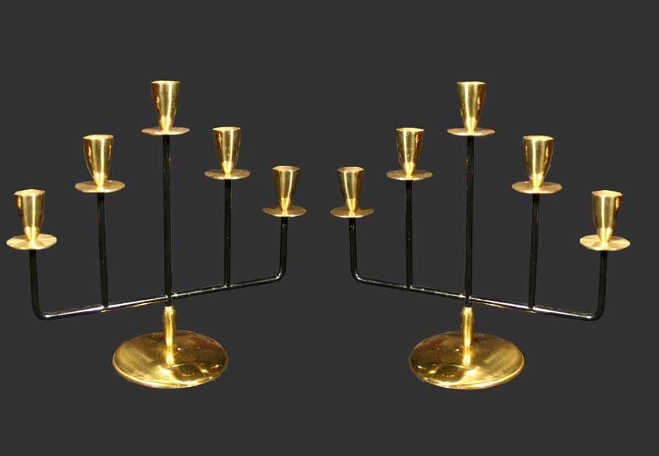 A fine pair of Vintage five light candelabras. A good example of the Modernist design of the mid century. The tapering gilt soccles are above drip pans all raised on painted black metal uprights which rest on round gilt bases.<br />
Made in Japan