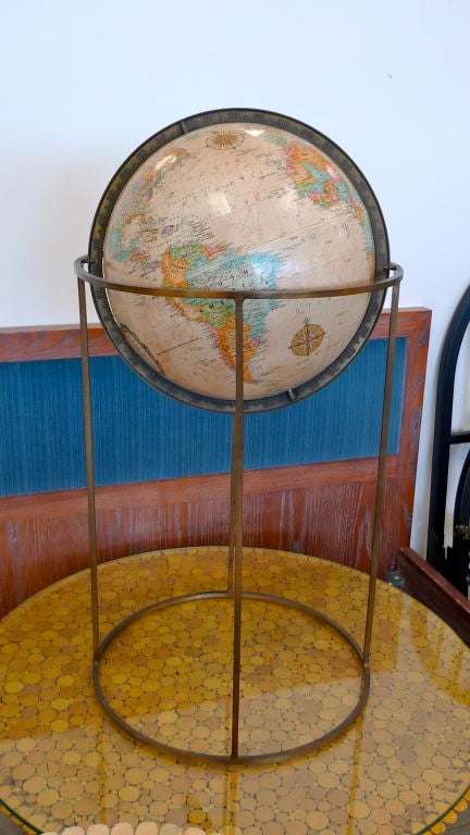 A Brass Framed Standing Replogle Floor Globe.

Cartographer LeRoy M. Tolman