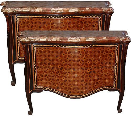 An important pair of 18th century Italian parquetry arbalete sans traverse commodes (dressers), each with two drawers and original locks, and embellished with intricate geometric patterns created with crossbanding, stringing, and butterfly veneers