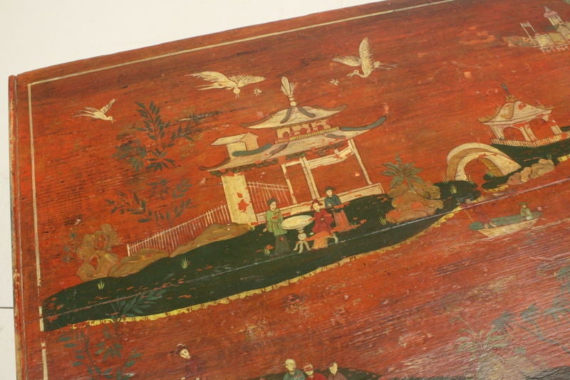 A delightful antique blanket box from England in the original rusty red paint, this charming trunk was recently painted with naive chinoiserie decoration, looks charming! Top lifts up for good storage, and there are two drawers below. Lovely